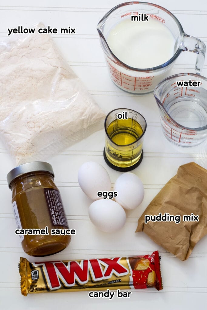 All of the ingredients needed to make the Easy Twix Poke Cake recipe.