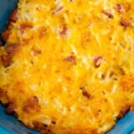 Overhead view of half of the Smoked Sausage Hash Brown Casserole in a casserole dish ready to be served.