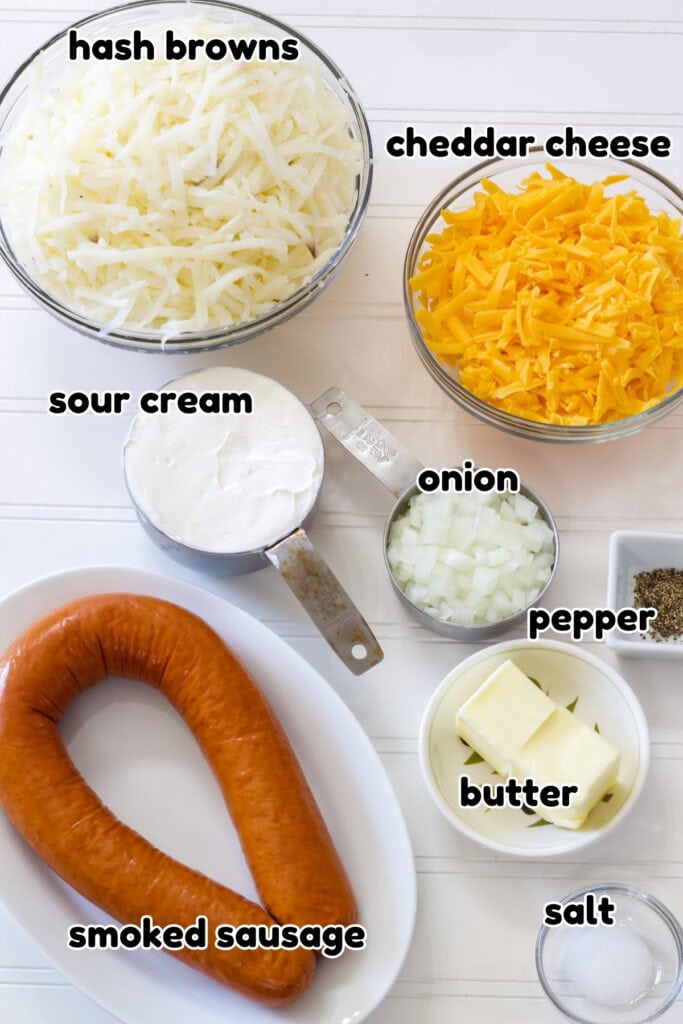 All of the ingredients needed to make the Smoked Sausage Hash Brown Casserole.