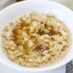 Feature image of an overhead shot of the bowl of Copycat Quaker Maple Brown Sugar Oatmeal.