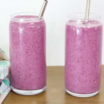 Feature image of the side view of two Blueberry Beet Smoothies.