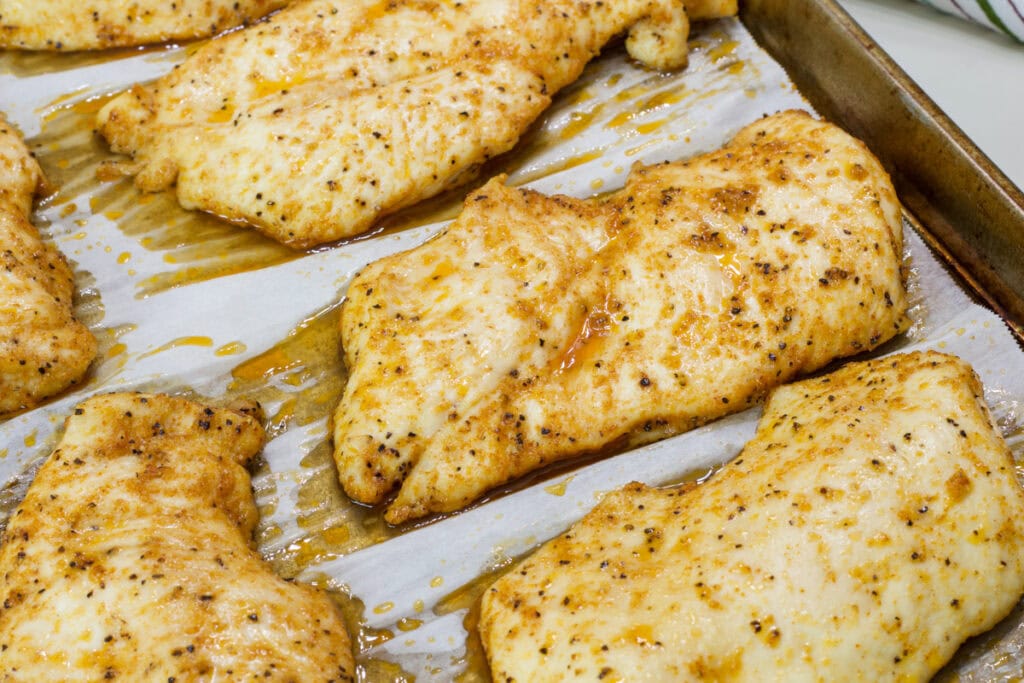 Close up shot of the Baked Thin Chicken Breasts after they came out of the oven.
