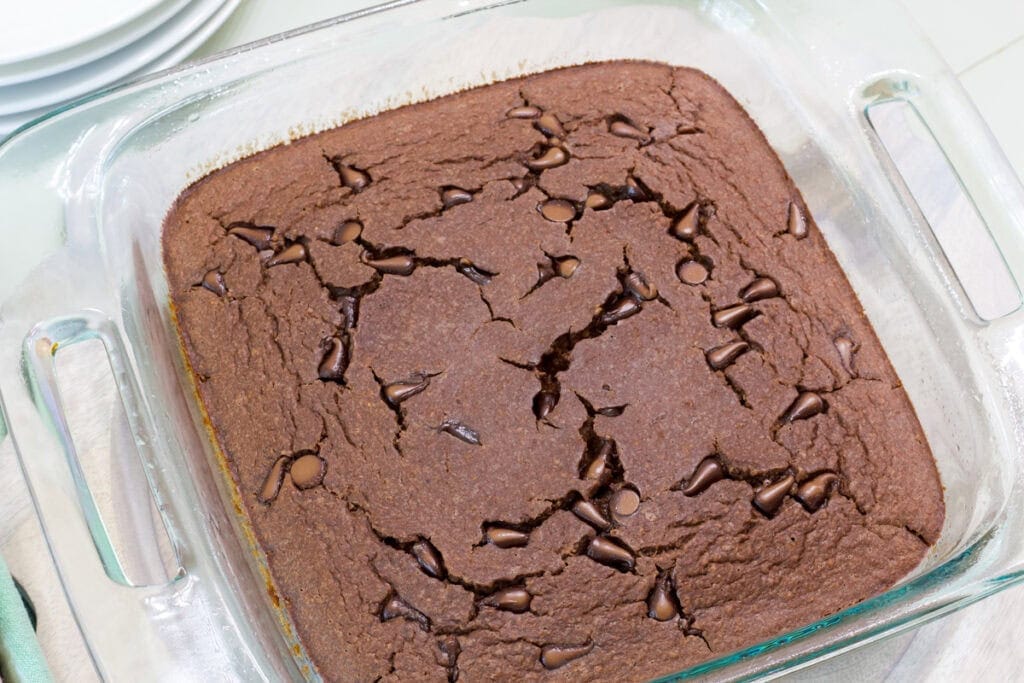 A baking dish with the baked chocolate chip oatmeal in it, uncut.