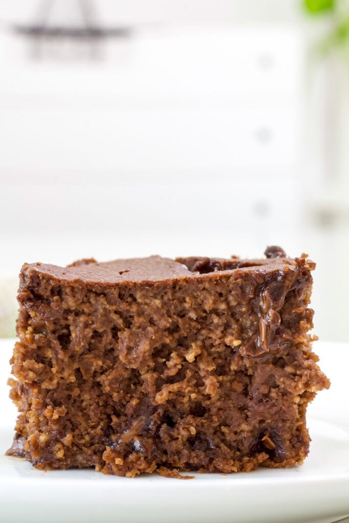 One serving of double chocolate chip baked oatmeal on a white plate.