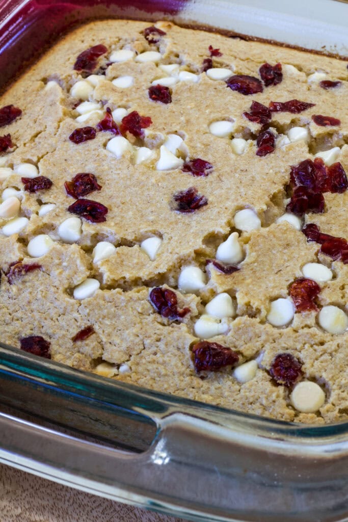 The pan of white chocolate chip cranberry Blended Baked Oats (no banana), uncut.