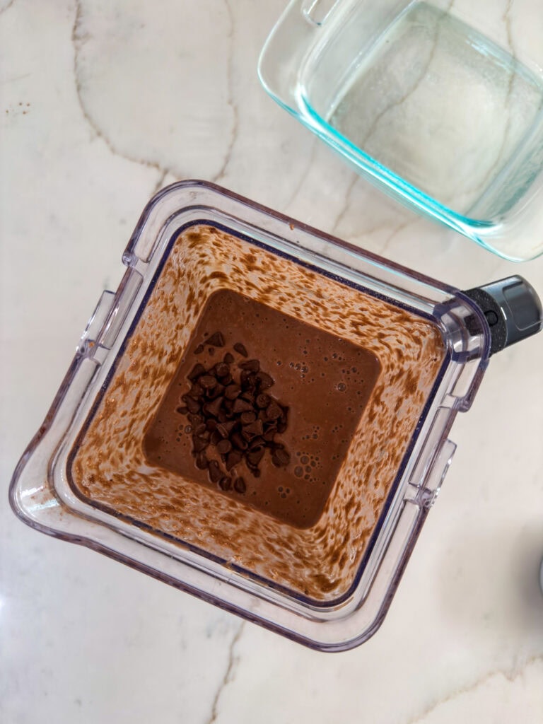 Overhead view of the ingredients with the chocolate chips added, before being mixed in.