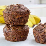 Feature image of tow muffins stacked one on top of the other.