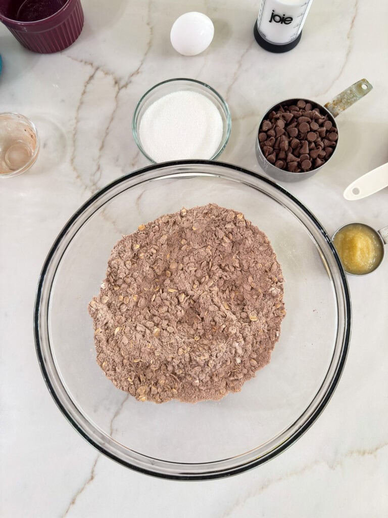 The dry ingredients mixed in a large glass mixing bowl.