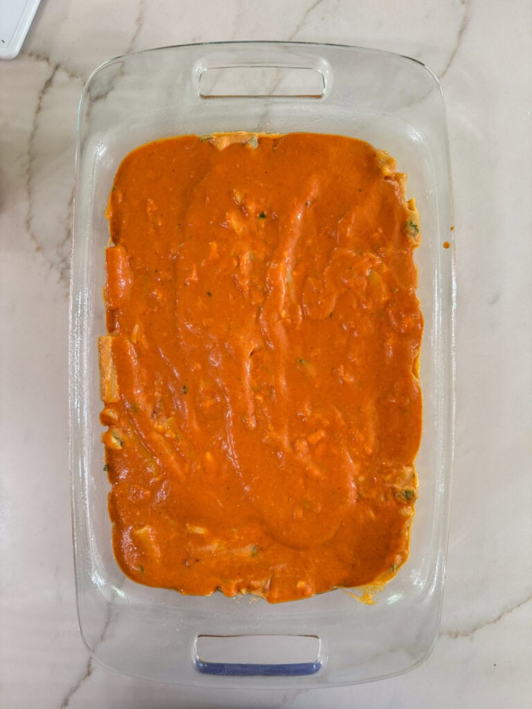 The remaining sauce added to the pasta mixture, ready for the cheese to be added.