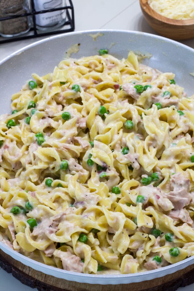 A frying pan filled with Pasta with Tuna and Peas.