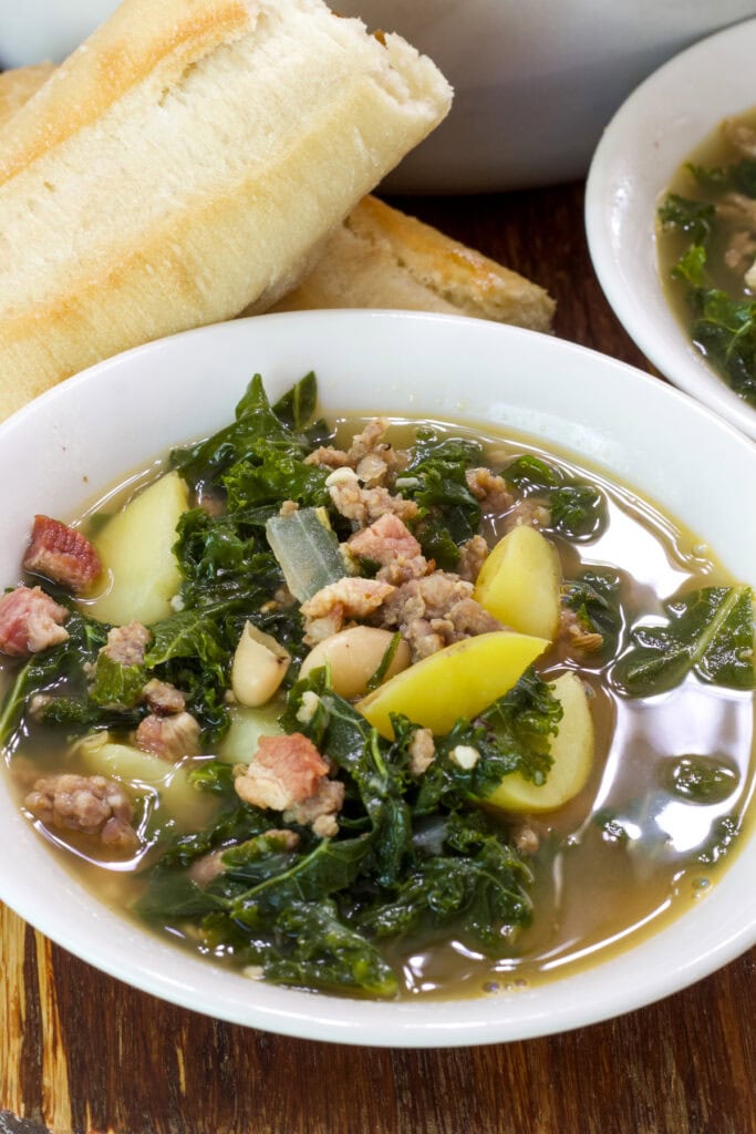 One serving of Dairy Free Zuppa Toscana in a white bowl.
