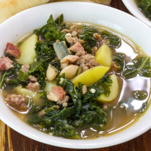 Feature image of the overhead shot of one serving of soup in a white bowl.