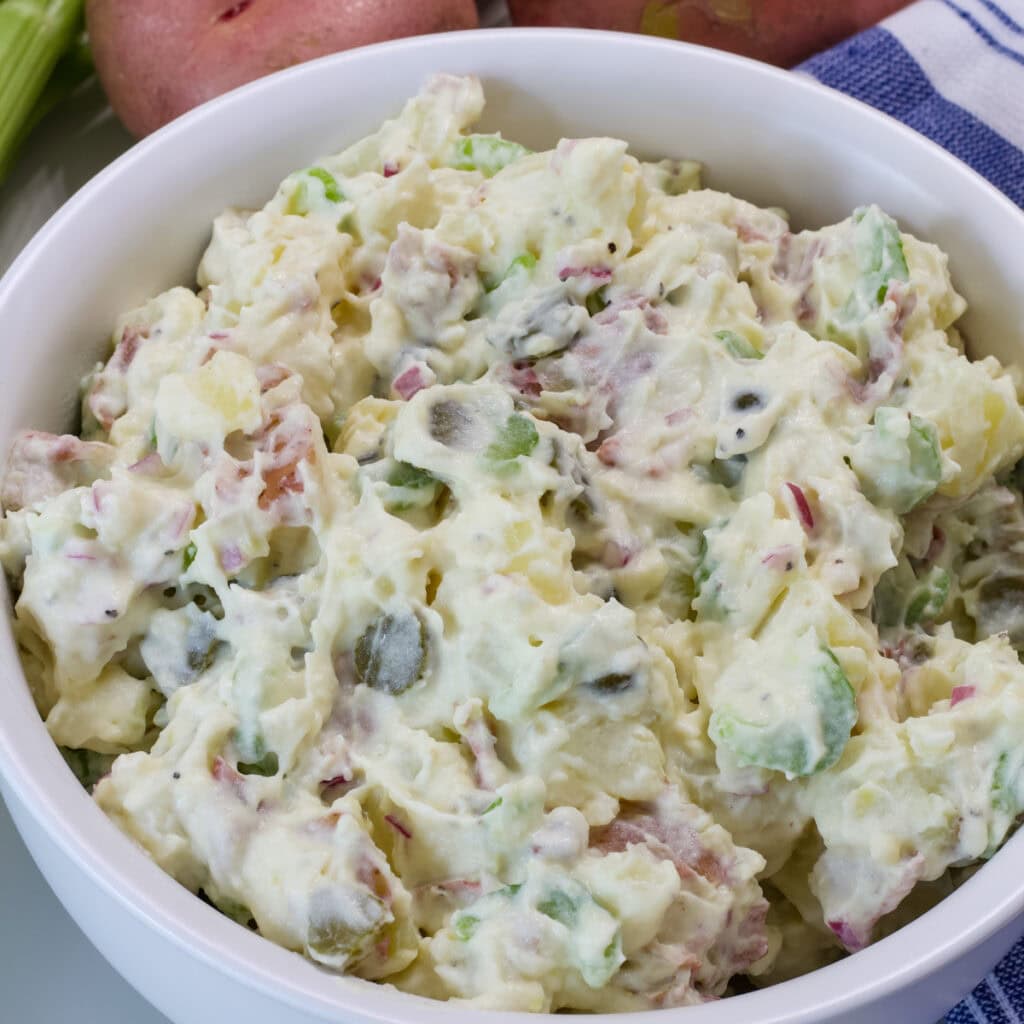 Feature image of the finished Healthy Potato Salad (no eggs) in a serving bowel.