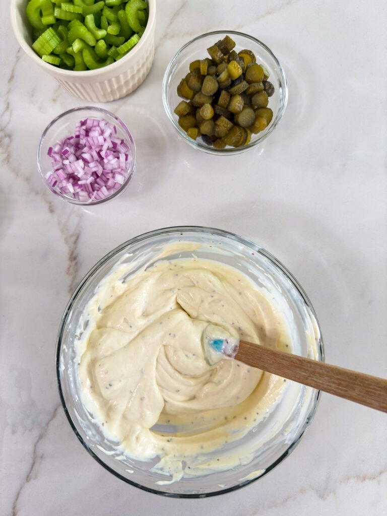 The creamy sauce mixed together in a small glass bowl.