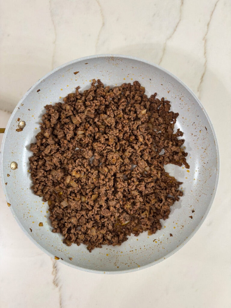The finished loose meat mixture in the skillet ready to make a sandwich.