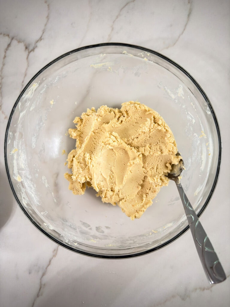 The other cookie dough ingredients added and mixed into the butter mixture.