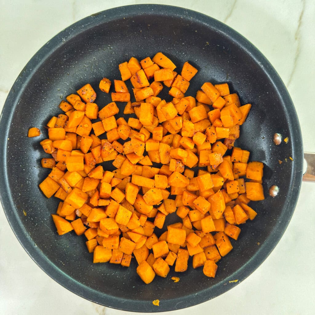 The finished Sautéed Sweet Potatoes in a skillet.