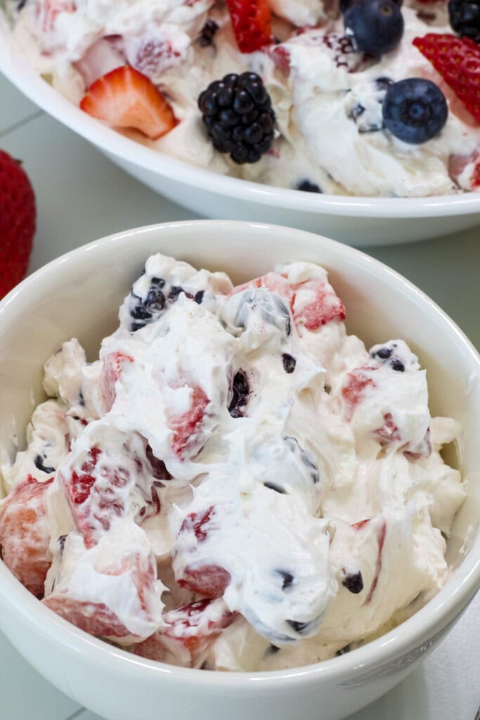 One serving of Triple Berry Cheesecake Salad in a small white bowl.