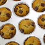 Feature image of the baked muffins still in the muffin pan.