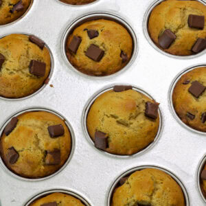 Feature image of the baked muffins still in the muffin pan.