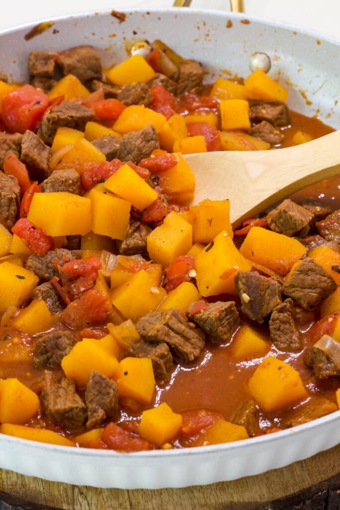 A skillet with the finished Beef Tagine with Butternut Squash in it.
