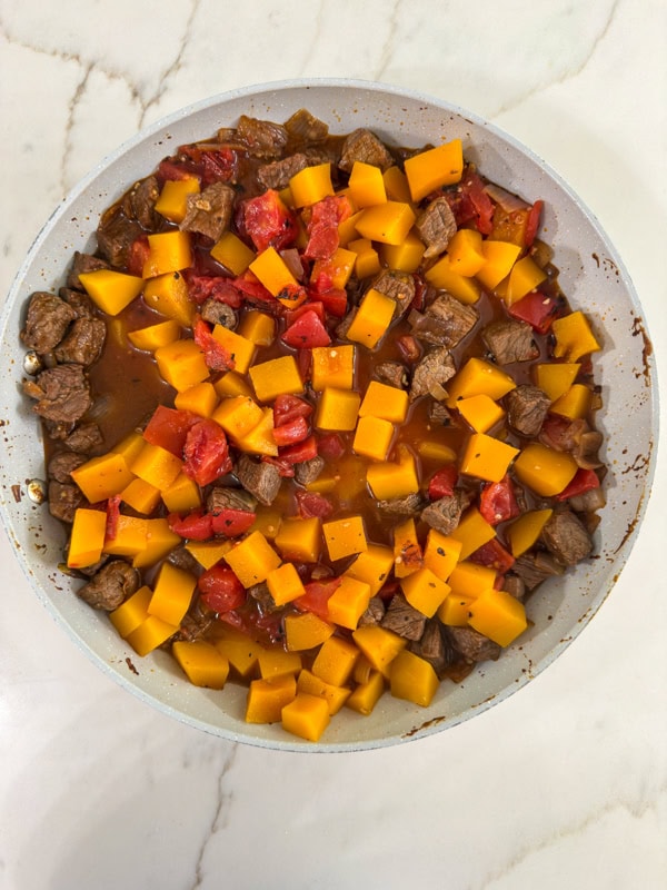 All of the ingredients added to the skillet ready to be heated through.