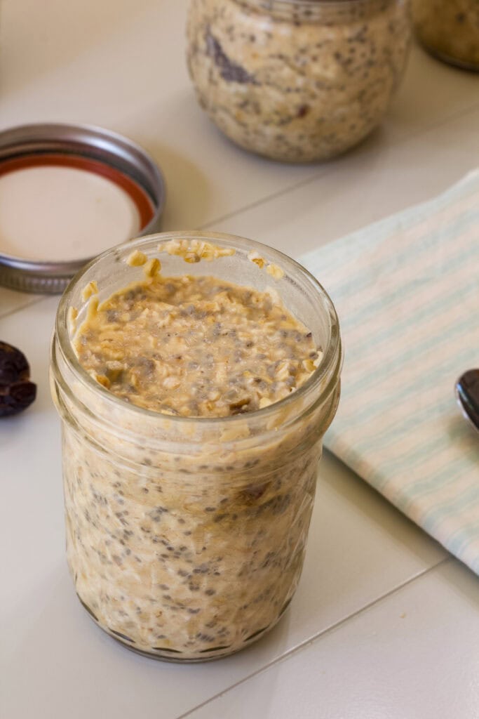 The Date Overnight Oats in a mason jar after they've been in the refrigerator for over 8 hours.