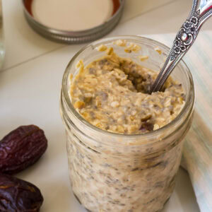 Overhead shot of the overnight oats in a jar with a spoon in it ready to eat.