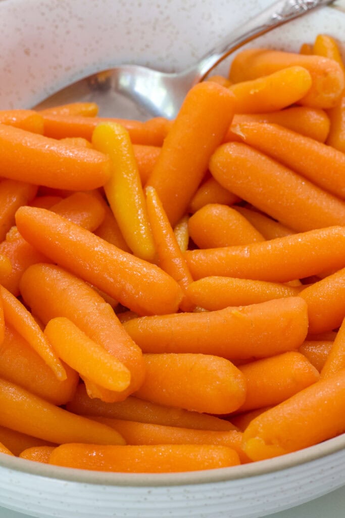Close up shot of the Honey Glazed Baby Carrots in a serving bowl.
