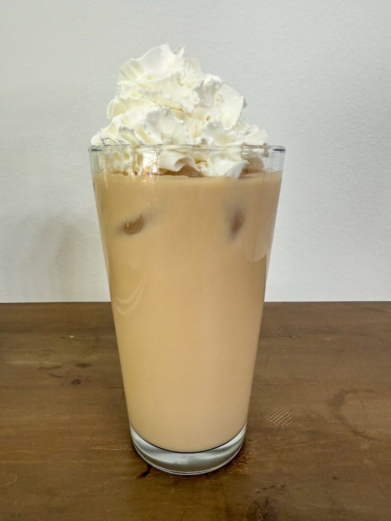 Whipped topping has been added to the top of the Iced White Chocolate Mocha.