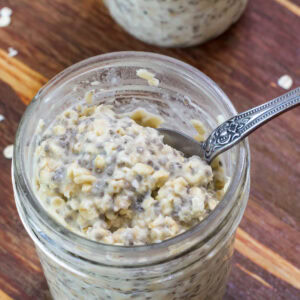 Feature image of a very close up shot of Maple Brown Sugar Overnight Oats in a jar.