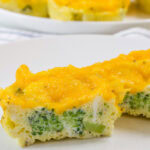 Feature image of a close up view of the center of the cut Broccoli Cheddar Egg Bite.