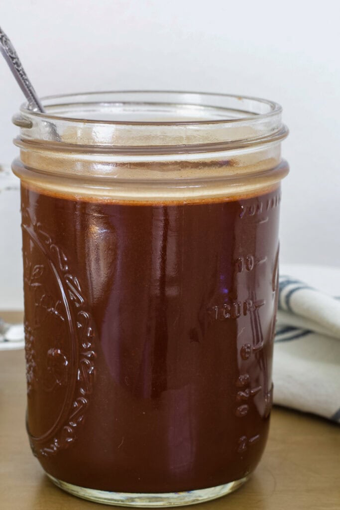 Side view of the mason jar with the Chocolate Coffee Syrup in it.