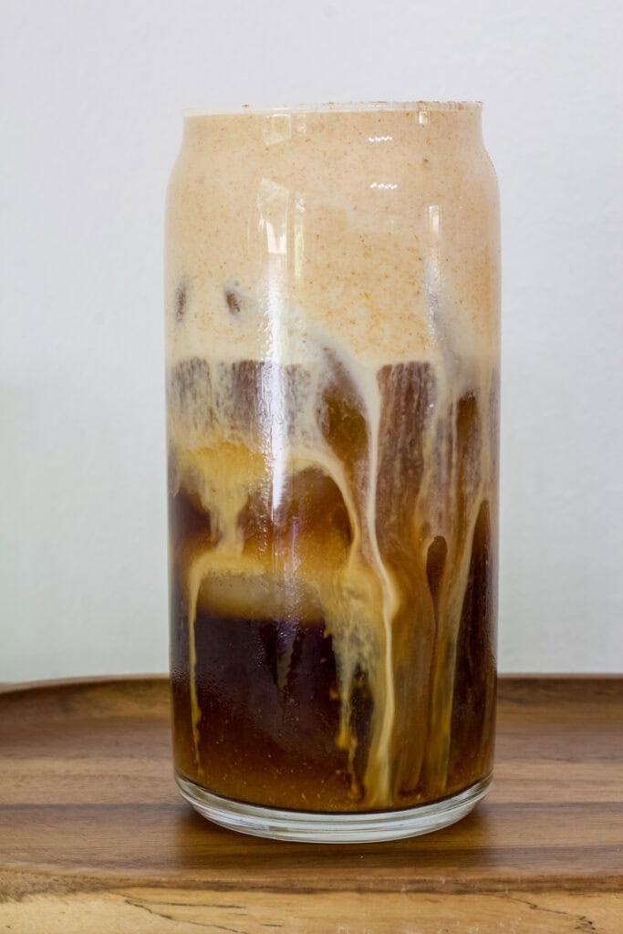 Side view of one glass of Pumpkin Cream Cold Brew.