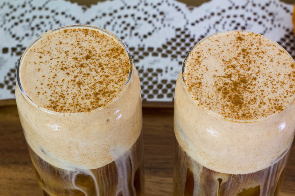 Top view of two glasses of Pumpkin Cream Cold Brew.