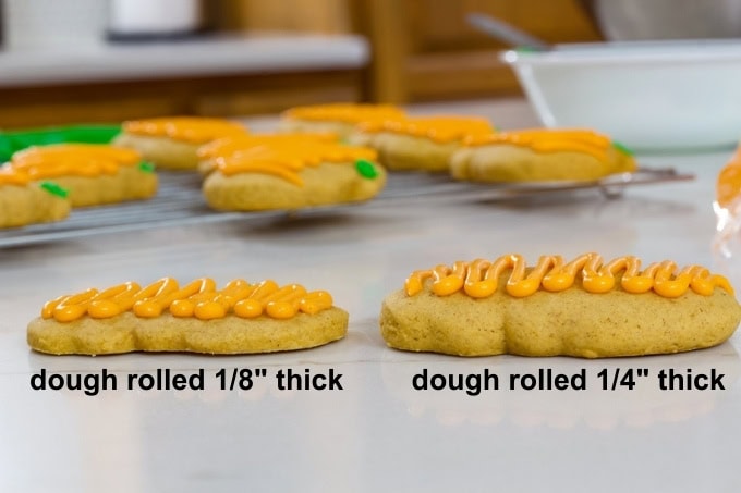 Side view of two cookies side-by-side so the thickness of them is visible, one is thin and one is thick.