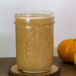 Feature image of the side view of a mason jar filled with Starbucks Pumpkin Sauce.
