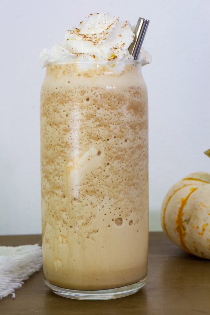 One copycat Starbucks Pumpkin Spice Frappuccino in a tall clear glass.