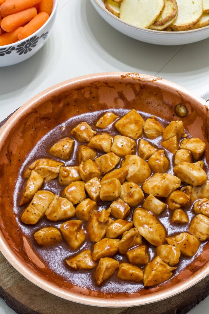 Overhead shot of the cooked BBQ Chicken Bites in a skillet ready to be served.