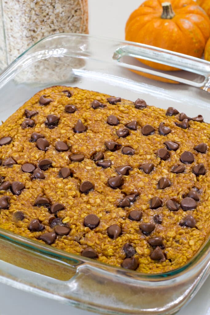 The whole baked Pumpkin Chocolate Chip Baked Oatmeal in a glass casserole dish.