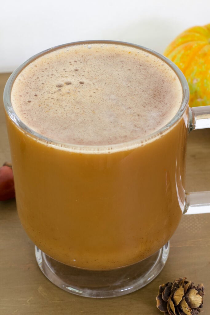 View of the top of the Pumpkin Spice Latte with Oat Milk so the oat milk is visible.