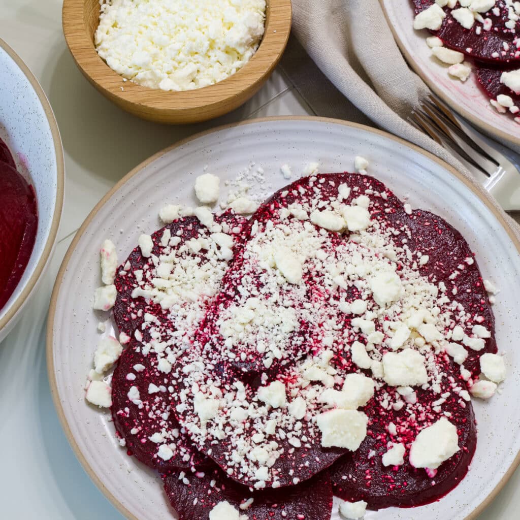 Overhead shot of one serving of Roasted Beets with Feta on a plate.