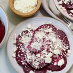 Overhead shot of one serving of Roasted Beets with Feta on a plate.