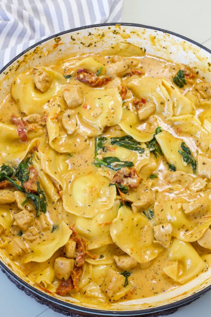 Full batch of Tuscan Ravioli with Chicken in a skillet.