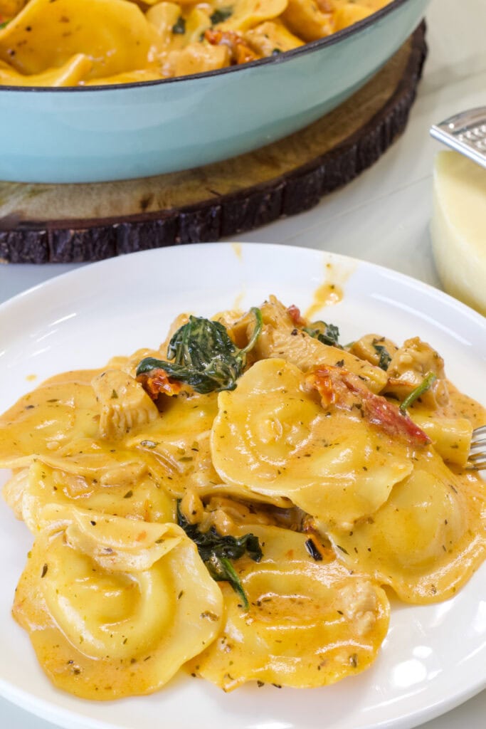 A serving of Tuscan Ravioli with Chicken on a plate.