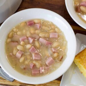 Overhead closeup of a bowl of 30-Minute White Beans with Ham (Easy One-Pot Comfort Food).