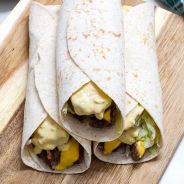 Three Big Mac Wraps with the meat and secret sauce visible.