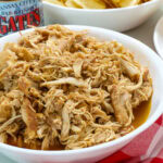 Close up of Slow Cooker Barbecue Chicken in a serving bowl, ready to eat.