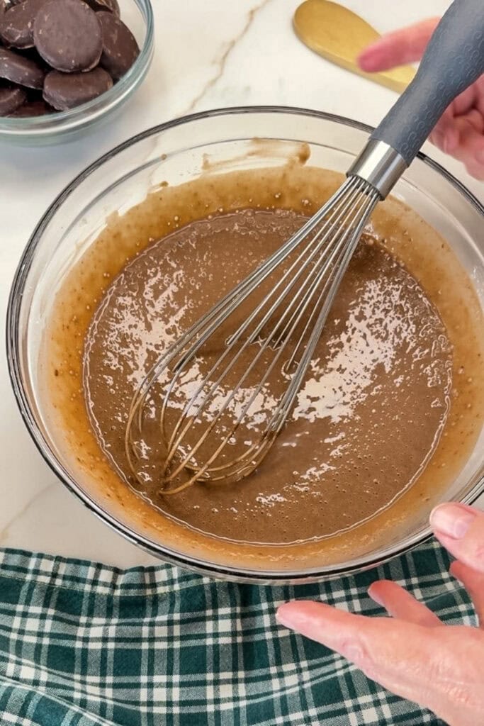 The chocolate pudding mix and the cold milk mixed together in a bowl.