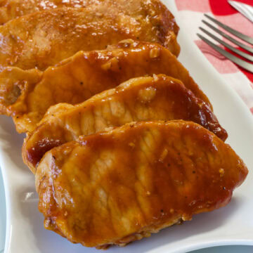 Close up of the Crockpot BBQ Cola Pork Chops ready to be eaten.